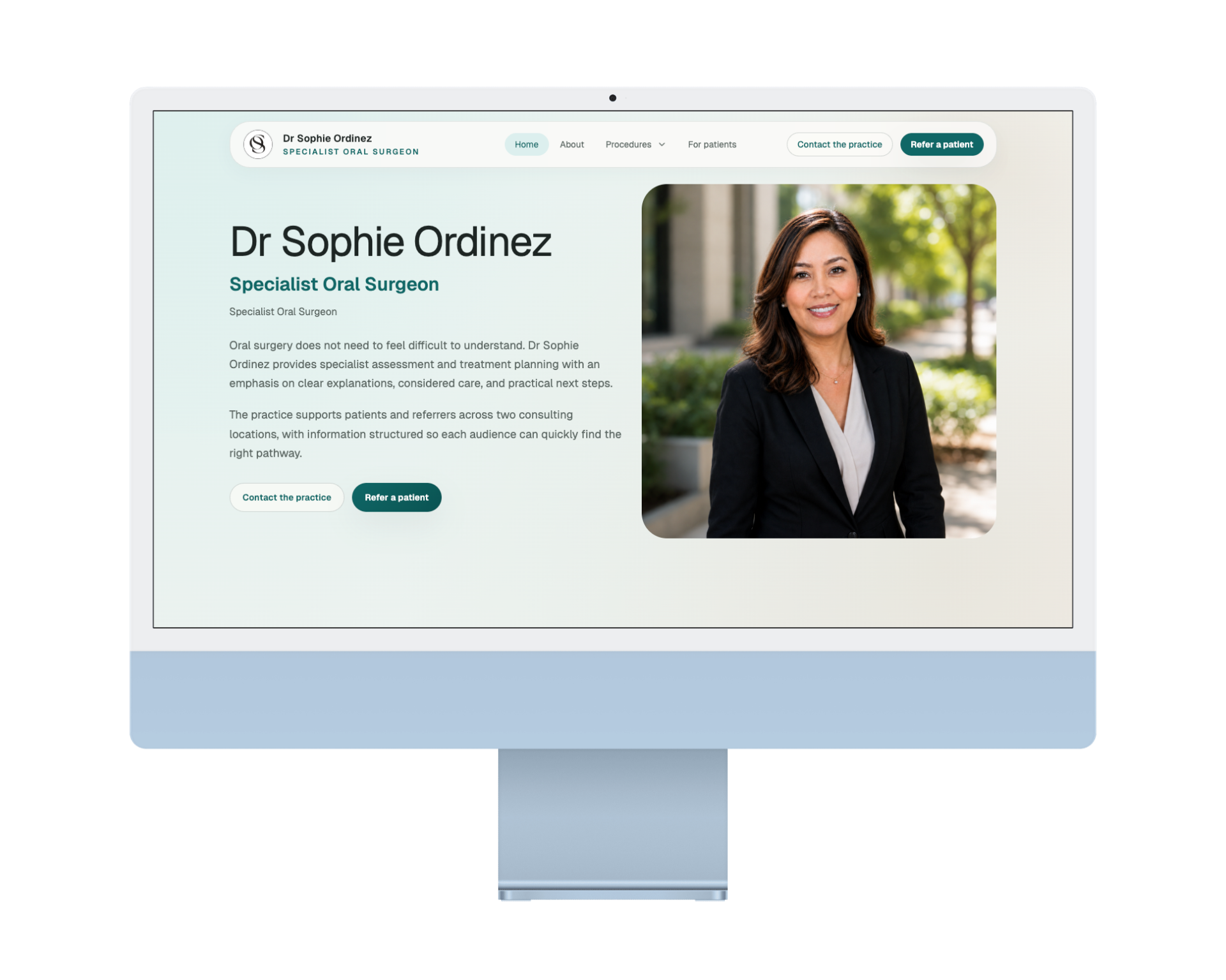Anonymized oral surgeon website homepage shown on a desktop monitor.